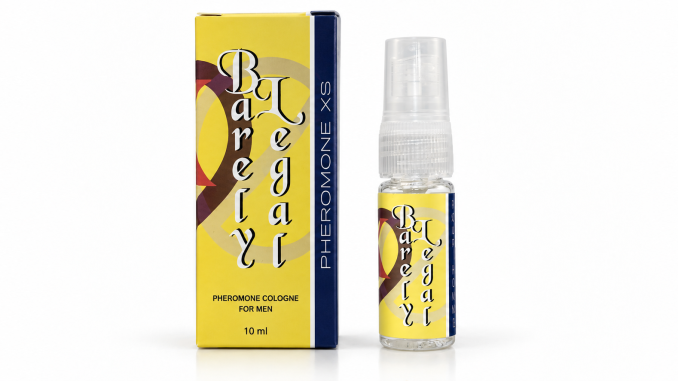 PheromoneXS Barely Legal XS106B men's pheromone spray in a clear 10 mL bottle with yellow label and transparent cap, displayed beside matching yellow retail packaging against a white background.