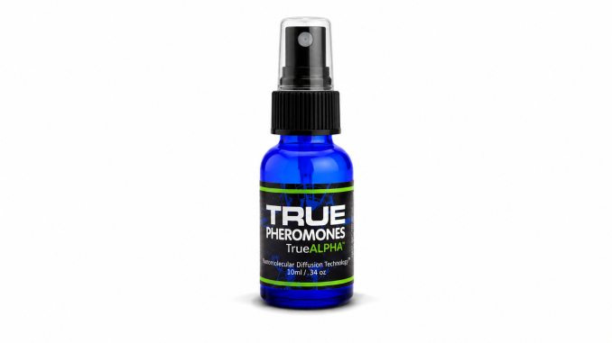 TRUE Alpha pheromone spray bottle for men, featuring cobalt-blue glass, a black spray cap, and a black label with green accents on a white background.