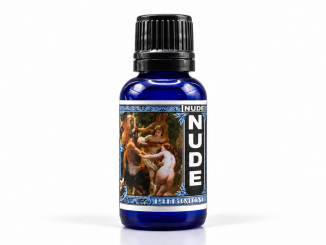 Liquid Alchemy Labs Nude Original men's pheromone oil in a cobalt-blue glass bottle with a black ribbed cap, classical artwork label, and vertical NUDE lettering against a clean white studio background.