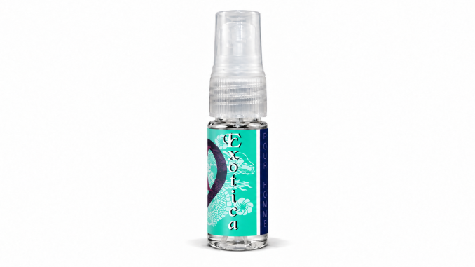 PheromoneXS Exotica XS men's pheromone spray in a clear 10 mL bottle with a transparent spray cap, turquoise-green floral label, vertical Exotica lettering, and navy-blue Pour Homme stripe against a white background.