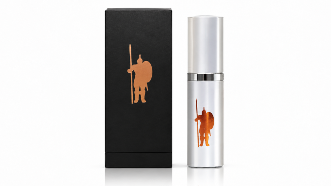 LaCroy IMPI Original men's pheromone cologne in a silver spray bottle with copper warrior emblem, displayed beside its black retail box against a white studio background.