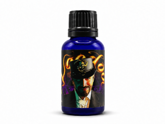 Liquid Alchemy Labs VooDoo pheromone cologne in a blue glass bottle with black cap and illustrated voodoo-themed label.