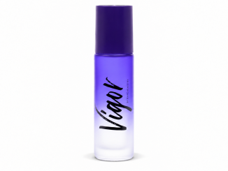 RawChemistry Vigor pheromone cologne roll-on for men in a purple gradient bottle with a dark-purple cap and black Vigor logo, photographed against a white background.