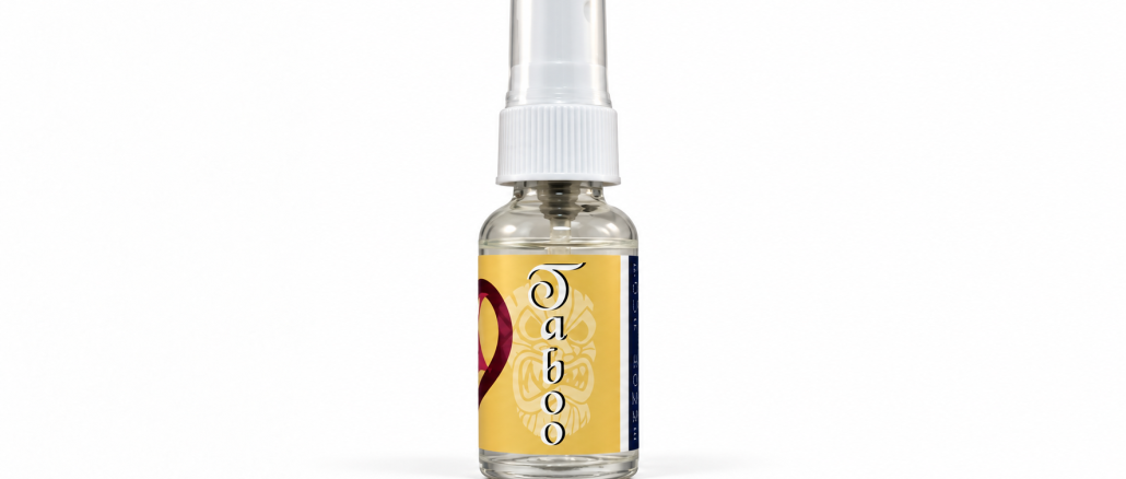 PheromoneXS Taboo XS pheromone bottle with transparent cap, white applicator, golden-yellow label, vertical Taboo lettering, and burgundy accents against a clean white studio background.