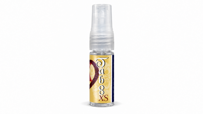 PheromoneXS Taboo XS pheromone spray for men in a clear 10 mL bottle with a transparent spray cap, gold decorative label, vertical Taboo lettering, and XS logo against a white background.