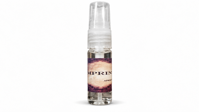 Apex Imprint pheromone spray for men in a clear 10 mL bottle with transparent spray cap and vintage parchment label against a white background.